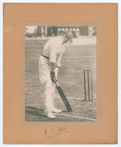Vernon Tickell Hill. Somerset 1891-1912. Excellent mounted photograph of Hill posed at the wicket, wearing Oxford University cap. The photograph laid down to photographers mount and signed by Hill to lower border. Overall 9.75&rdquo;x12&rdquo;. Good condition