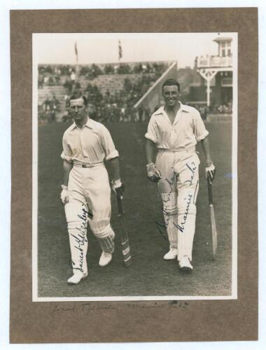 M.C.C. Australian Touring Team v C.I. Thornton&rsquo;s XI, Scarborough 1928. Original mono photograph of Ernest Tyldesley (Lancashire) and Maurice Tate (Sussex) walking out to bat for M.C.C. at Scarborough with crowds in the stands in the background, for the ma