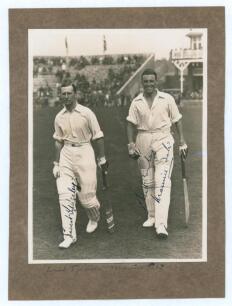 M.C.C. Australian Touring Team v C.I. Thornton&rsquo;s XI, Scarborough 1928. Original mono photograph of Ernest Tyldesley (Lancashire) and Maurice Tate (Sussex) walking out to bat for M.C.C. at Scarborough with crowds in the stands in the background, for the ma