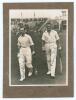 M.C.C. Australian Touring Team v C.I. Thornton&rsquo;s XI, Scarborough 1928. Original mono photograph of Ernest Tyldesley (Lancashire) and Maurice Tate (Sussex) walking out to bat for M.C.C. at Scarborough with crowds in the stands in the background, for the ma