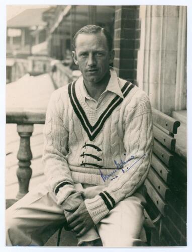 Robert Walter Vivian Robins. Cambridge University, Middlesex & England 1926-1951. Original mono photograph of Robins, three quarter length in cricket attire sat in front of a pavilion, probably Lord&rsquo;s. Signed by Robins to photograph. The photograph measur