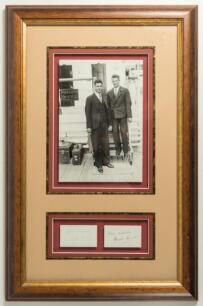 M.C.C. Tour of Australia &lsquo;Bodyline&rsquo; 1932/33. Bill Voce and Harold Larwood. Excellent mono photograph of the two players on board ship wearing suits and ties outside the &lsquo;Wireless Office&rsquo;. Attractively mounted with the individual ink signatures of both pl