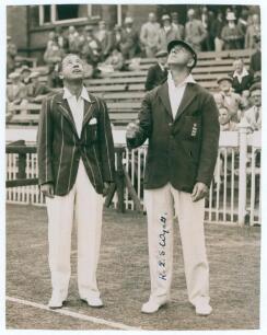 Robert Elliott Storey &lsquo;Bob&rsquo; Wyatt. Warwickshire, Worcestershire & England 1923-1951. Original mono press photograph of the captains, R.E.S. Wyatt of England and Herbie Wade of South Africa tossing for innings for the 4th Test at Old Trafford, 27th- 30th 
