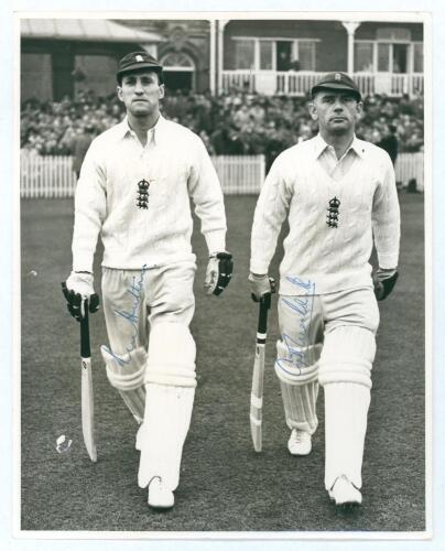 Len Hutton & Cyril Washbrook. Mono press photograph of Hutton and Washbrook walking out to bat at Trent Bridge Nottingham, with large crowd to pavilion behind, probably in the Trent Bridge Test of 1948 against the Australians. Both players wearing England