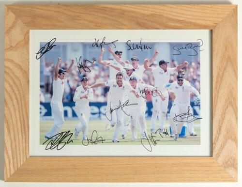 England v Australia 2013. Colour photograph of Jimmy Anderson and the England team celebrating taking the final wicket of Brad Haddin to win the first Test at Trent Bridge in 2013 by 14 runs. The photograph signed by all eleven members of the England tea