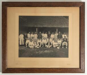 W.G. Grace at the cricket circa 1900. Large original mono photograph of two cricket teams, seated and standing in rows, at the front of a cricket pavilion in the early 1900s. Grace is seated in the second row wearing cricket attire. Match unknown. The pho