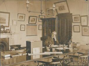 Surrey C.C.C. Scenes of The Oval 1895. Three original sepia photographs depicting the club secretary, Charles Alcock, seated in his office, another of groundsman Samuel Apted seated in the Long Room, and a view of the entrance to the pavilion. The photogr