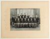 New Zealand tour to India and Pakistan 1964/65. Large original mono photograph of the New Zealand touring party seated and standing in rows wearing tour blazers. The photograph, by Rangoon Studio, New Delhi, is laid to official photographer&rsquo;s mount, which