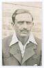 Ghulam Mohammad. Muslims, Sind & India 1924-1939. Mono postcard size photograph of Mohammad, head and shoulders, wearing Indian blazer. Signed in ink to image. Photograph by F.J. Worcer of London. Minor adhesive marks to corners on the verso otherwise in 