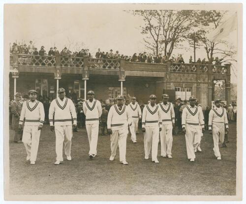 All India tour to England 1936. Large original mono press photograph depicting the Indian team being led on to the field by captain Maharai Kumar of Vizianagram for the opening match of the 1936 tour v A.P. [Tich] Freeman&rsquo;s XI at the Bat and Ball Ground,