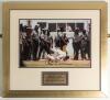 &lsquo;Brian Lara 375 not out. 5th Test, Antigua, April 1994&rsquo;. Large colour photograph of Lara bent down on his knees to kiss the turf of the Antigua Recreation Ground having achieved the historic event. Signed to image by Lara &lsquo;375&rsquo;. Attractively mounted, fram