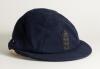 Hedley Verity. Yorkshire & England 1930-1939. England navy blue cloth Test cap with raised wired emblem of the three lions and crown to front. The cap made by E.C. Devereux of Eton, Bucks with &lsquo;H. Verity&rsquo; handwritten in black ink to inner label of cap. Od