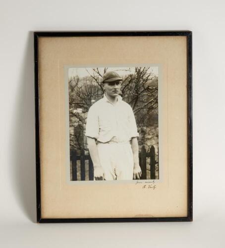 Hedley Verity, Yorkshire & England, 1930-39. Excellent large original mono photograph of Verity, three quarter length, wearing cricket attire and proudly wearing his England cap standing in front of a picket fence. Very nicely signed &lsquo;Yours sincerely H. V