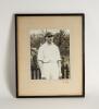 Hedley Verity, Yorkshire & England, 1930-39. Excellent large original mono photograph of Verity, three quarter length, wearing cricket attire and proudly wearing his England cap standing in front of a picket fence. Very nicely signed &lsquo;Yours sincerely H. V