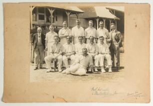 &lsquo;Yorkshire County Cricket Team 1932&rsquo;. Official mono photograph of the Yorkshire team seated and standing in rows wearing cricket attire in front of a pavilion. Players featured include Sellers (captain), Sutcliffe, Macauley, A. Rhodes, Holmes, Wood, Barbe